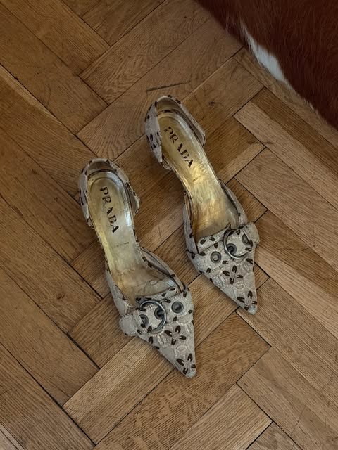 Embellished pointed slingback shoes on parquet