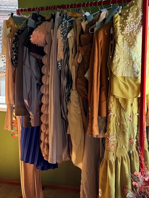 A rail of embellished dresses and textured garments